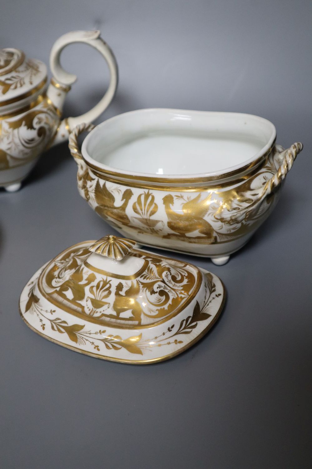 A Derby gilded part tea set, two Derby sucrier and covers and a similar dish, c.1790-1810, blue, puce, gilt and iron red marks